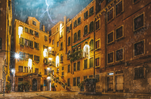 Venice streets with evening lights rain and thunder no people italian architecture