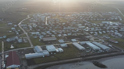 Coastal town in Iceland Reykjanes peninsula Sandgerði with bright sunrise, aerial photo