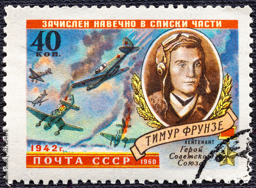 USSR - CIRCA 1960: A stamp printed in USSR shows Planes in Combat and Timur Frunze 1923-1942 , a World War II hero. photo