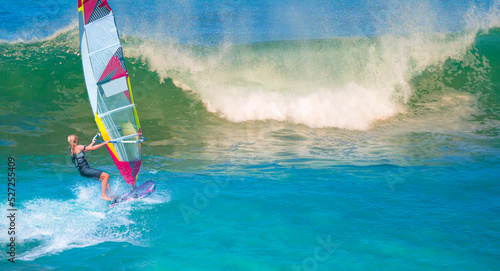 Windsurfer surfing the wind on power sea waves