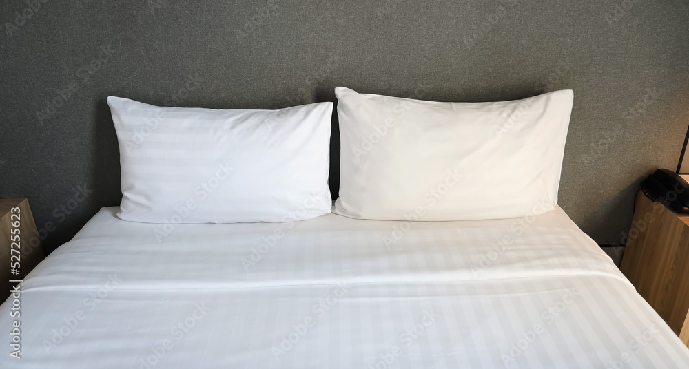 Obraz premium White cushion and white pillow which Modern bedroom interior with a stylish combination of trendy room image