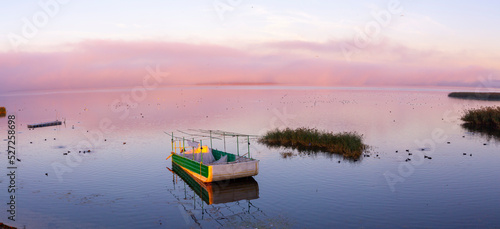 The golyazi village on the shores of the Uluabat lake in bursa. Landscape from Golyazi with green nature and reflection photo