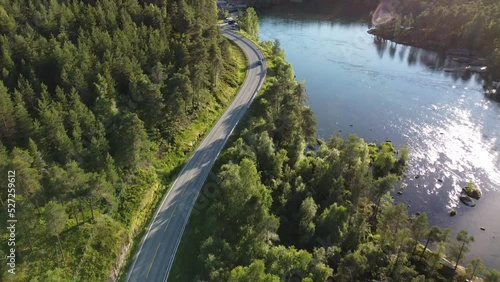 Car passing by a lake in the evening photo