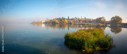 The golyazi village on the shores of the Uluabat lake in bursa. Landscape from Golyazi with green nature and reflection photo