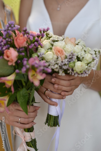 Two girls hold beautiful bouquets, brides with flowers