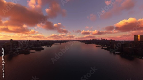 Aerial sunset view of the Hudson River in New Jersey, skyscrapers and buildings in New York. United States of America