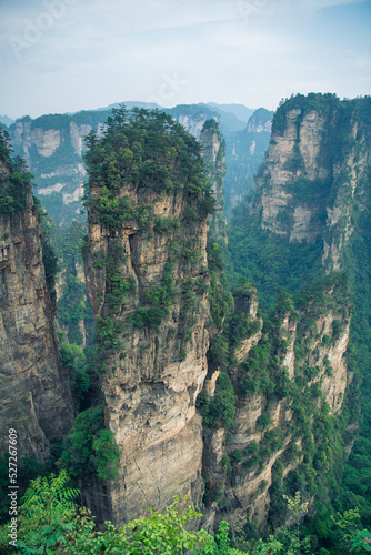 Amazing view of natural quartz sandstone pillar the Avatar Hallelujah Mountain among green woods and rocks in the Tianzi Mountains, the Zhangjiajie National Forest Park, Hunan Province, China.