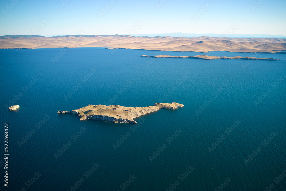 Lake Baikal from the air on a summer day. View of the islands of Ogoy, Oltrek and Olkhon.