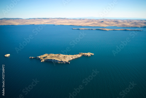 Lake Baikal from the air on a summer day. View of the islands of Ogoy, Oltrek and Olkhon.