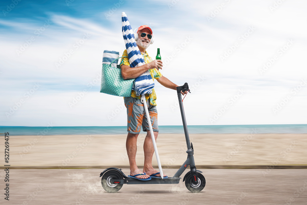 Senior tourist riding an electric scooter - obrazy, fototapety, plakaty 