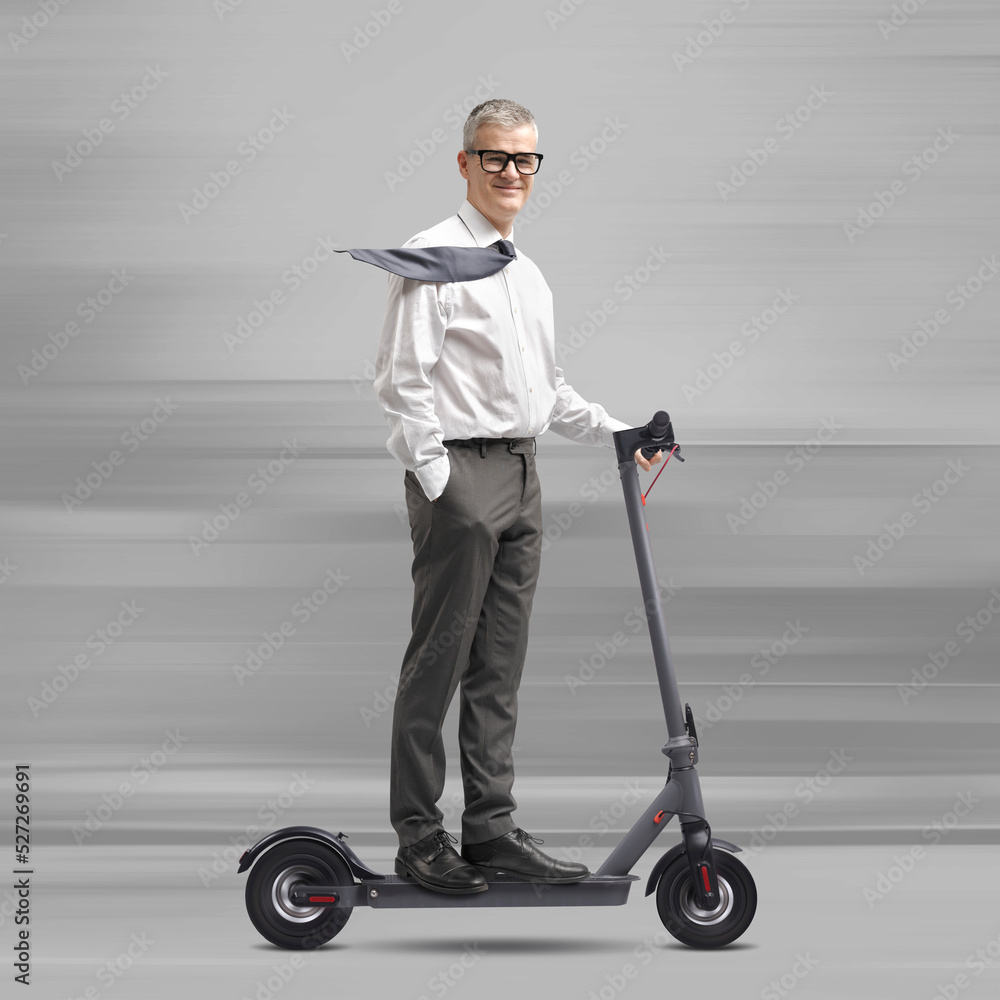 Fast businessman riding an electric scooter Fast businessman riding an electric scooter