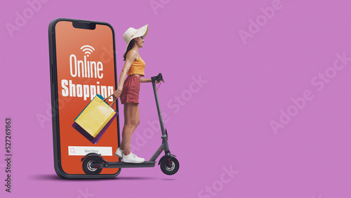 Woman doing online shopping and riding a scooter