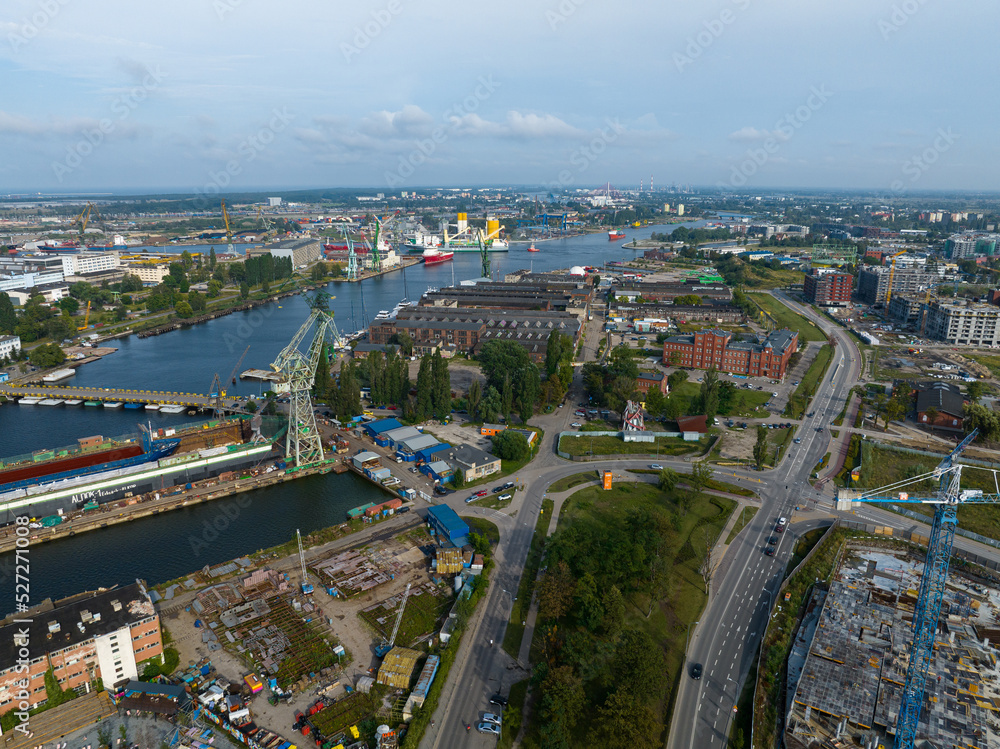 Cranes in Gdansk Shipyard Aerial View. Motlawa River Industrial Part of the City Gdansk, Poland. Europe.  - obrazy, fototapety, plakaty 