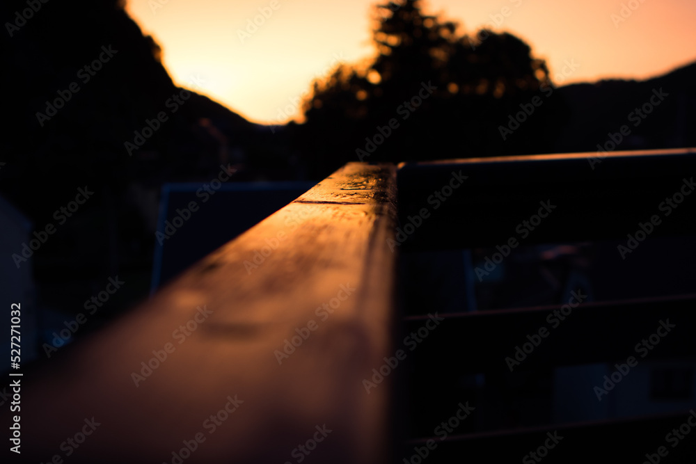 Sunset with reflexion on wet wood