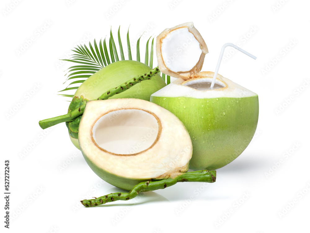 Young green coconut with coconut juice in half fruit and palm leaf