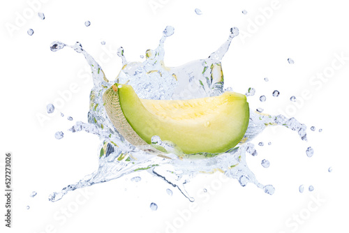 Green cantaloupe melon in water splash isolated on white background. photo