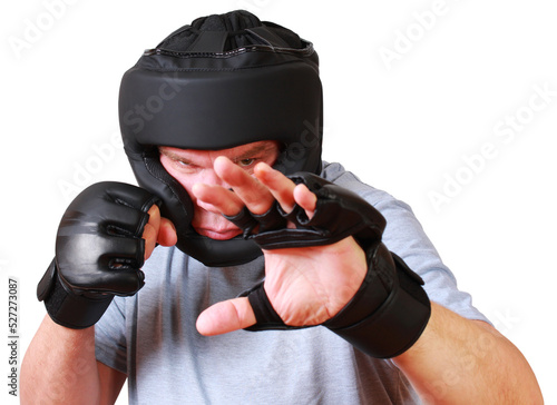 A professionl MMA fighter with gloves and protective headgear in an attack stance. Close-up half-length portrait. Isolation on a white background photo