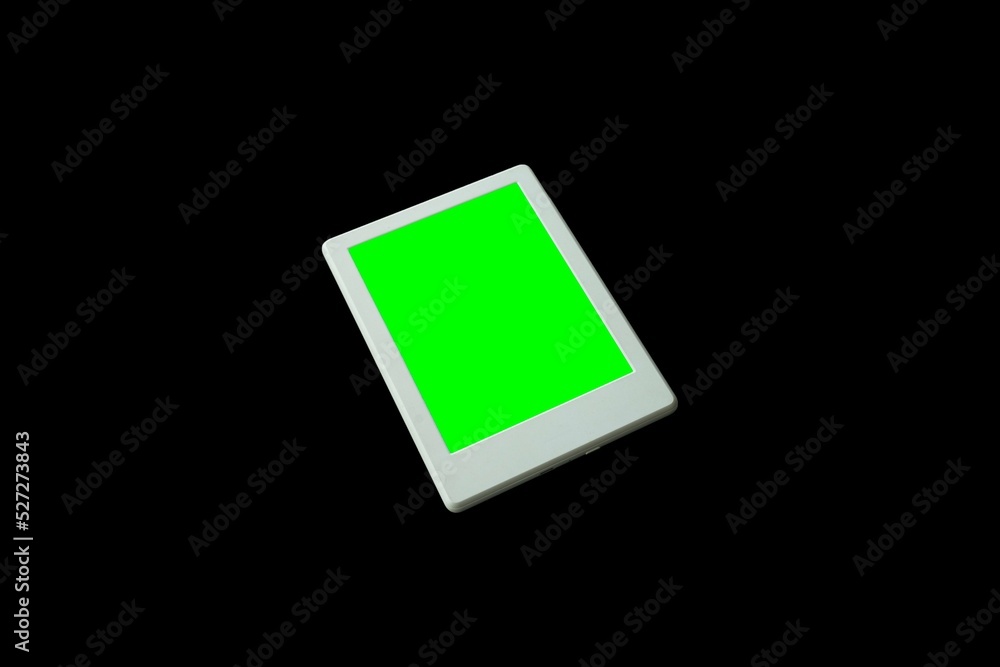 eReader isolated on black background. Green screen for mockup. Stock