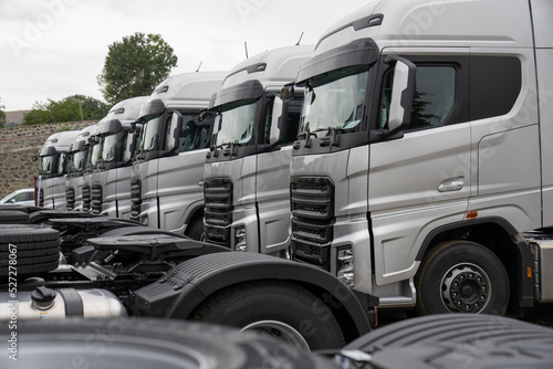 New heavy trucks in truck store, trucks lined up, truck market