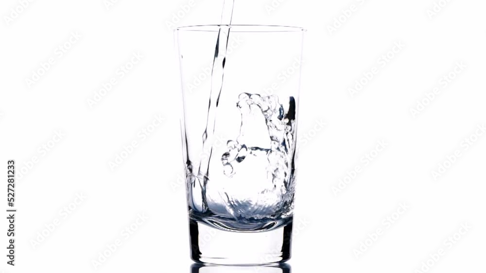 Fresh clean drink water in glass, Pouring pure drinking water into clear glass, splash out isolated on white background, slow motion. Concept of Drink Water, Flow, Healthy, Life, Nature, Transparent Fresh clean drink water in glass, Pouring pure drinking water into clear glass, splash out isolated on white background, slow motion. Concept of Drink Water, Flow, Healthy, Life, Nature, Transparent