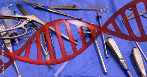 Image of dna strand over surgical instruments