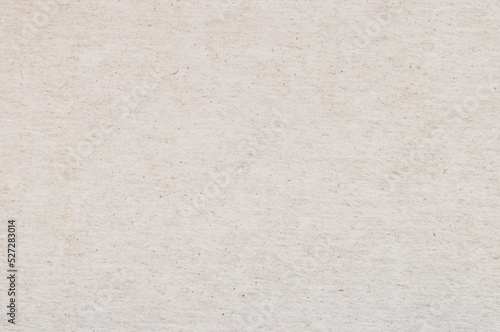 Craft paper texture, a sheet of beige recycled cardboard texture as background 