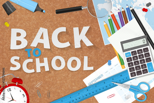 Back to School with school supplies placed on cork board.