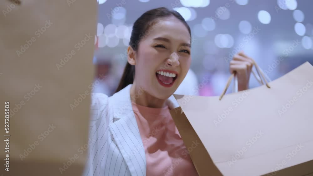 portrait Beautiful asian female woman girl show shopping bags walk exited cheerful enjoy hand gesture smiling while shopping in female boutique department store malls happiness woman shopping mall portrait Beautiful asian female woman girl show shopping bags walk exited cheerful enjoy hand gesture smiling while shopping in female boutique department store malls happiness woman shopping mall