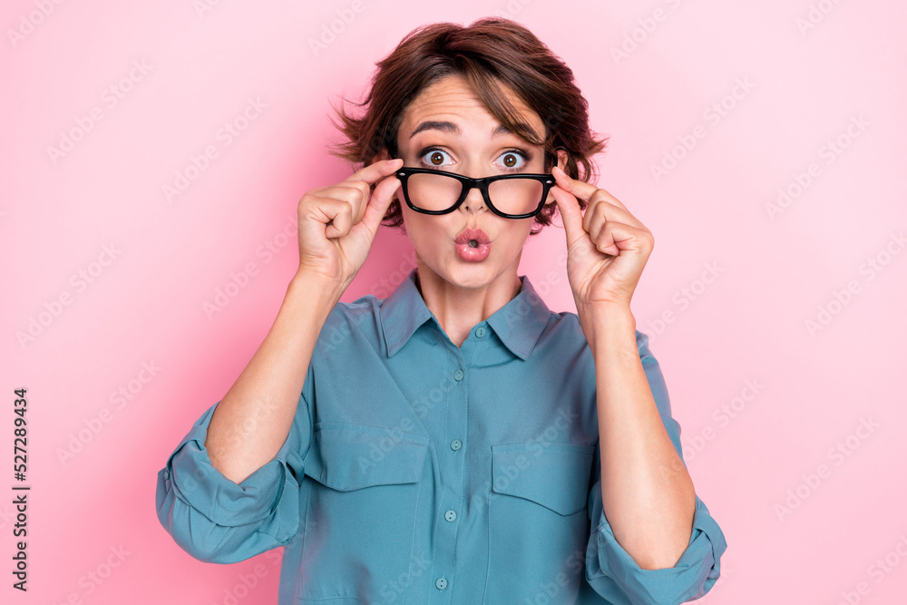 Closeup photo of young adorable pretty nice positive funny grimace woman trying her new eyewear shocked result correction pouted lips isolated on pink color background