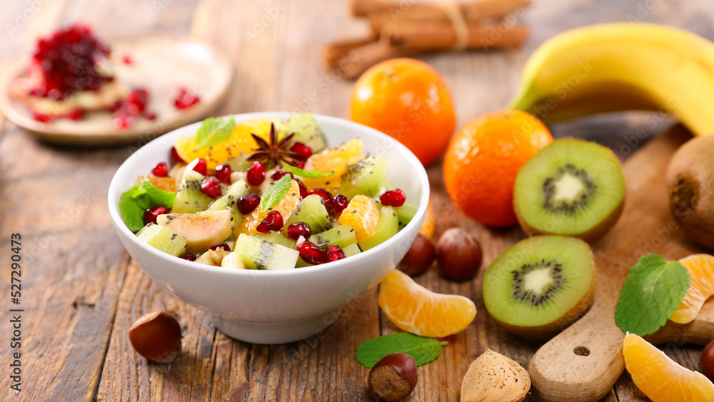fresh mixed fruit salad ( clementine, banana, kiwi and pomegranate) fresh mixed fruit salad ( clementine, banana, kiwi and pomegranate)