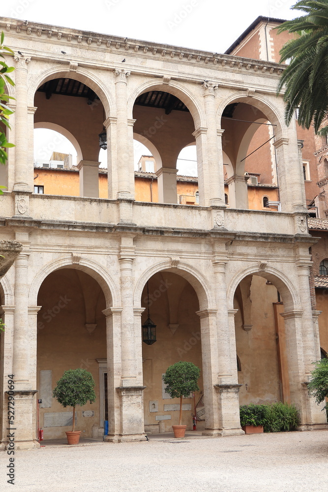 Palazzo Venezia Courtyard Detail with Archways and Plants in Rome, Italy