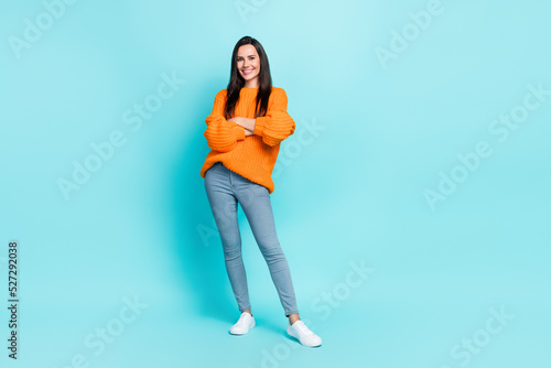 Full body portrait of gorgeous friendly lady crossed arms toothy smile isolated on teal color background