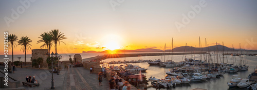 Panoramic view from the Bastioni of Alghero at sunset, in the background Capo Caccia, Sassari - Sardinia