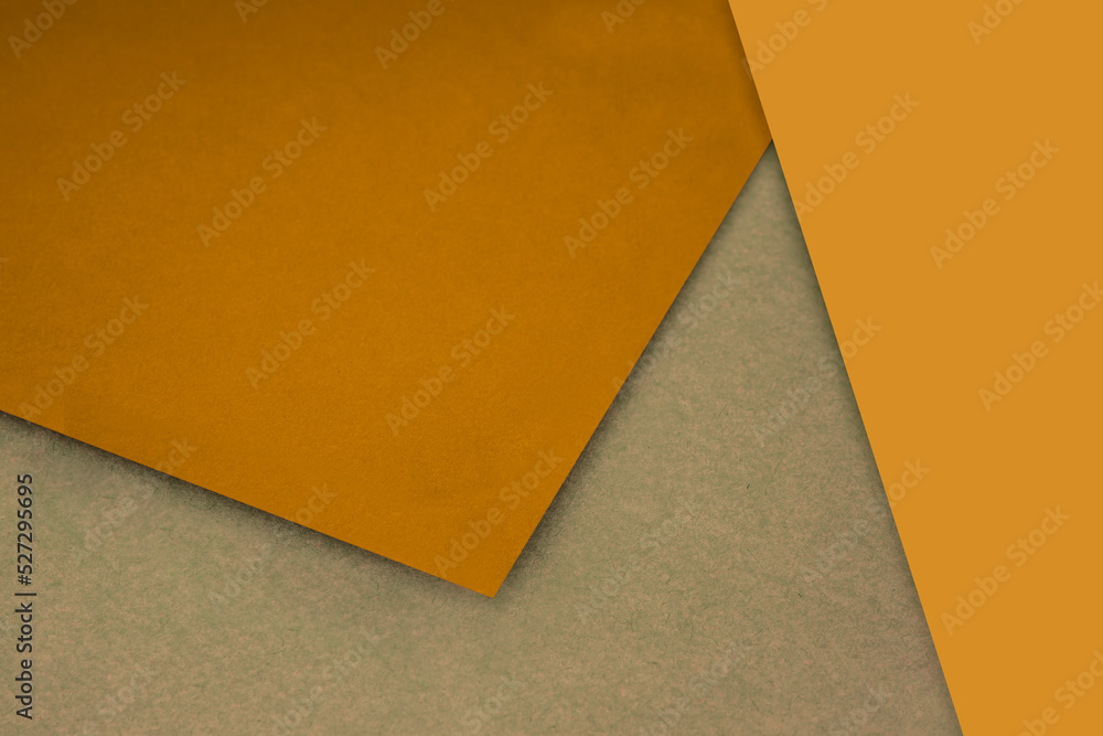 Plain and Textured mustard yellow brown papers randomly laying to form M like pattern and triangle for creative cover design idea Plain and Textured mustard yellow brown papers randomly laying to form M like pattern and triangle for creative cover design idea
