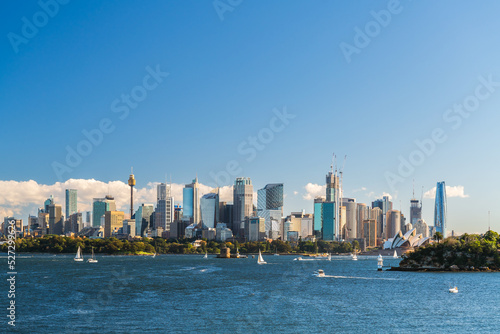 Beautiful panorama of Sydney city skyline viewed across the harbour from the Taronga Zoo Wharf on a bright day