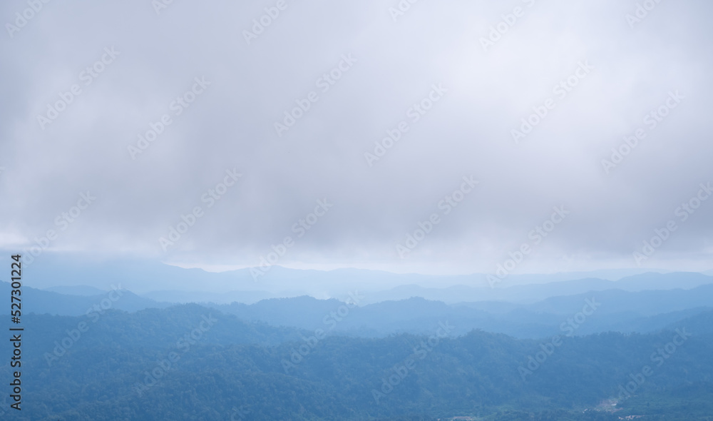 The mountains and clouds converge and thick fog