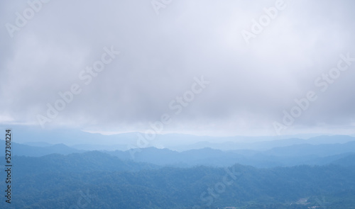 The mountains and clouds converge and thick fog