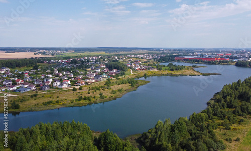 Aerial view of a beautiful suburban lake in an expensive elite neighborhood