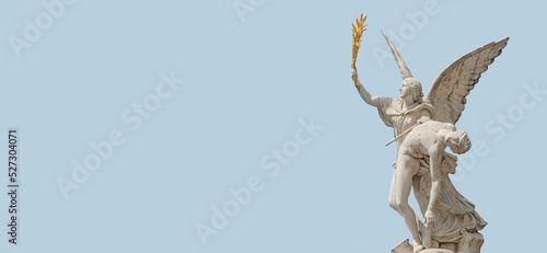 фотографія Banner with Roman statue of an angel holding a fighter at war at Schloss Bridge near Berlin Cathedral and Unter den Linden street in historical and museum downtown of Berlin, Germany, with copy space