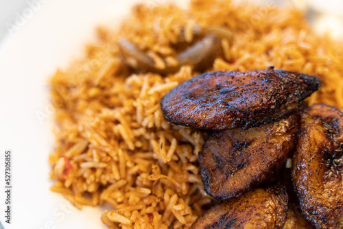 Nigerian Spicy Jollof rice with plantain © primestockphotograpy