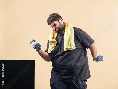 obese young man plays sports in an online class