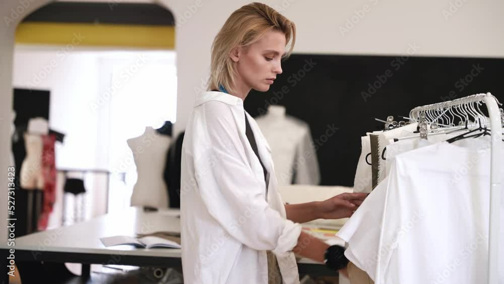 Team of fashion designers at work in a clothing design studio