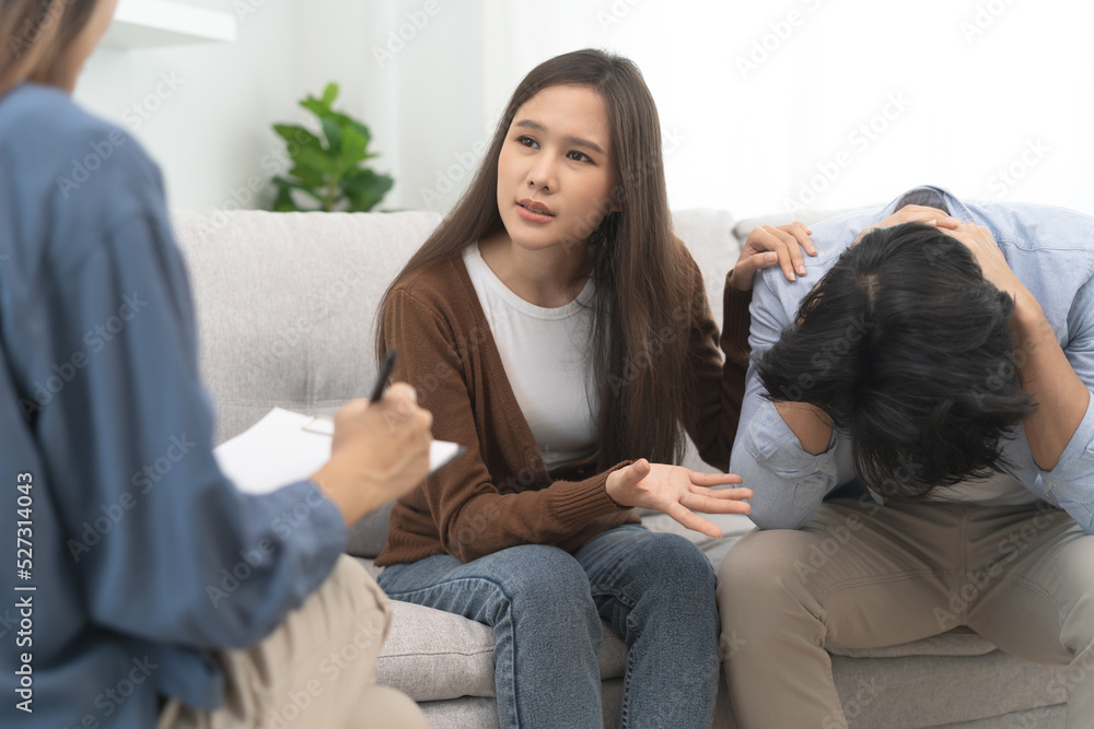 couple relationship therapy with a counselor. Close Up hands of the woman client during a conversation with psychologist to find problems and solution. couple relationship therapy with a counselor. Close Up hands of the woman client during a conversation with psychologist to find problems and solution.
