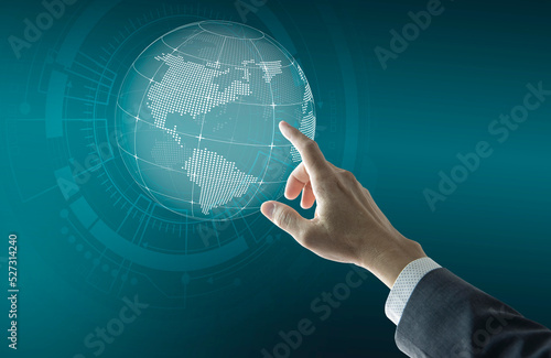 Right hand of a businessman touching futuristic digital globe to set business network growth to world wide