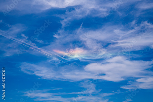 Circumzenithal arc against blue sky with white clouds seen in south of France near Marseille during summer 2019 (31st July 2019) photo