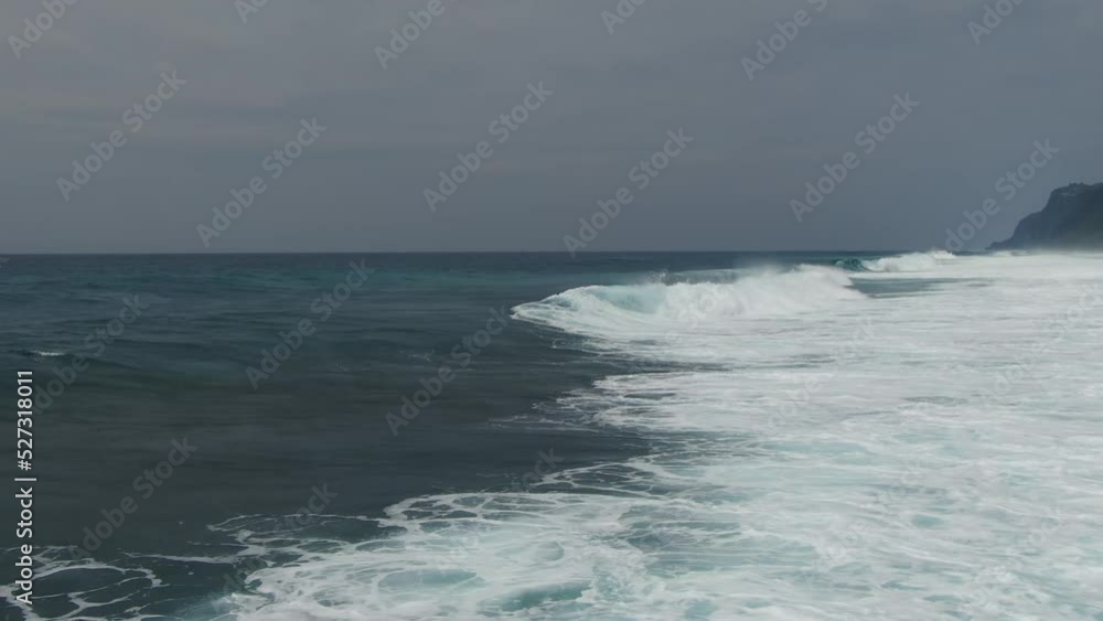 Ocean surf waves at high tide in Indonesia, Bali Ocean surf waves at high tide in Indonesia, Bali