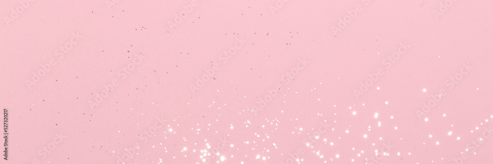 Sparkling silver glitter on pink background banner texture. Abstract holiday blurred lights header. Wide screen wallpaper. Panoramic web banner with copy space for design Sparkling silver glitter on pink background banner texture. Abstract holiday blurred lights header. Wide screen wallpaper. Panoramic web banner with copy space for design