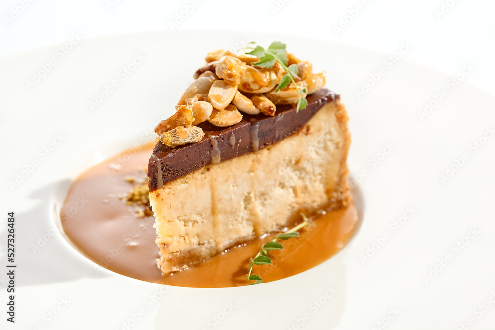 Nuts tart isolated on white background. Sweet pie with nuts and caramel sauce. Dessert with praline, chocolate and cashew, hazelnut, peanut and caramel sauce. Toffee nut pie in restaurant menu.