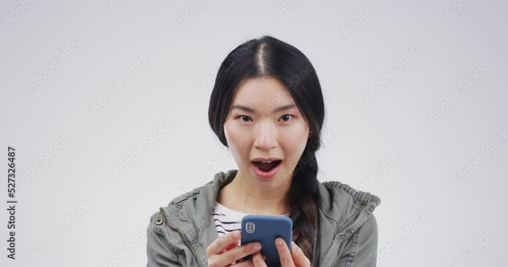 Wow, smartphone and social media news with woman shocked, surprised and happy with online gossip alert. Mockup space, smile and Asian girl amazed by discount, deal and fake announcement notification Wow, smartphone and social media news with woman shocked, surprised and happy with online gossip alert. Mockup space, smile and Asian girl amazed by discount, deal and fake announcement notification