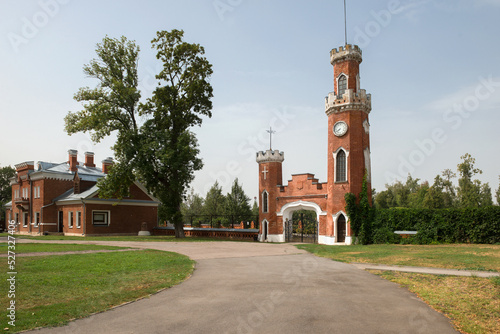 Ramon, Voronezh Region,  Entrance gate with a tower and clock. The palace complex of the Oldenburgskys. This is the only place of residence of royal persons in the Chernozem region. photo